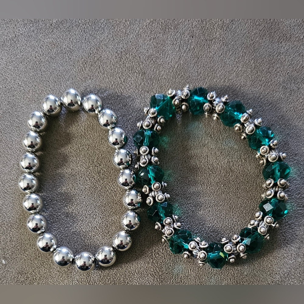 Handmade beaded bracelets with a bohemian vibe featuring green and silver colors